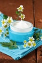 Natural cosmetic cream lotion with camomile Royalty Free Stock Photo