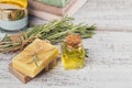 Natural cosmetic oil and natural handmade soap with rosemary on Royalty Free Stock Photo