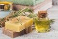 Natural cosmetic oil and natural handmade soap with rosemary on Royalty Free Stock Photo