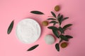 Natural cosmetic. Olive cream, pebble stone and ingredient on pink background, flat lay Royalty Free Stock Photo