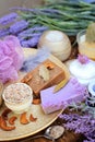 Natural cosmetics concept background - coffee and lavender artisan soap, salt scrub, cream and flowers Royalty Free Stock Photo