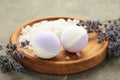 Natural cosmetics. Handmade lavender bath bombs and lavender flowers on wooden board Royalty Free Stock Photo