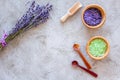 Natural cosmetics with lavender and herbs for homemade spa on stone background top view mock up Royalty Free Stock Photo