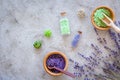 Natural cosmetics with lavender and herbs for homemade spa on stone background top view mock up Royalty Free Stock Photo