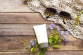 Natural cosmetics for skin face sunscreen spf50 ,crochet ,sunglasses and purple flowers Royalty Free Stock Photo