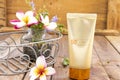 Natural cosmetics for skin face sunscreen spf50 health care surface with flowers frangipani