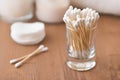 Natural cotton buds in glass container