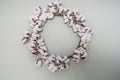 Natural cotton wreath on light aqua wall