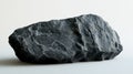 Natural Dark Stone with Textured Surface on Light Background Royalty Free Stock Photo