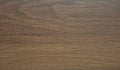 Natural dark walnut, wood texture on a cut closeup. Background. Close up shot Royalty Free Stock Photo