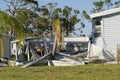 Natural disaster consequences. Severely damaged by hurricane mobile homes in Florida residential area