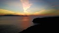 Natural dramatic sunset sunrise with white cloud and blue sky as background of black coral Royalty Free Stock Photo