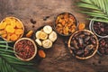 Natural Dried fruits in bowls. Healthy food snack: sun dried organic mix of apricots, figs, raisins, dates and other on wooden Royalty Free Stock Photo