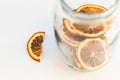 Natural Dried Orange Slices In Glass Jar. Healthy Snack. Christmas And New Year Decorations.
