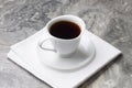 Natural drink chicory in a white Cup and saucer on napkin