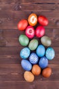 Natural dyed easter eggs on wood background