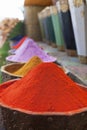 Natural dyes, colorful and vibrant pigment powders in wooden pots Royalty Free Stock Photo