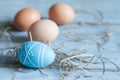 Natural Easter eggs and blue abstract