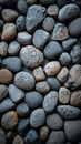 Natural elegance close up of rounded grey river rocks formation