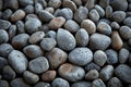 Natural elegance close up of rounded grey river rocks formation