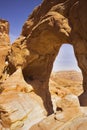 Erosive arch in hills from red sandstone