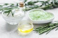 Natural essential aroma oil with rosemary on stone table background Royalty Free Stock Photo