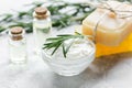 Natural essential aroma oil with rosemary on stone table background Royalty Free Stock Photo