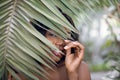 Natural exotic beauty, wellness. Close up portrait of smiling pretty mysterious African woman model, posing to camera