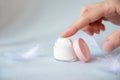 Natural face cream in a cosmetic jar. Female hand tries to smear cream Royalty Free Stock Photo