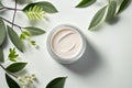 Natural face cream in petri dish on a white table and plant branches, copy space