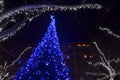 Festive decorated Christmas tree with blue led lights Royalty Free Stock Photo