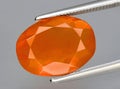 natural fire orange opal gem on the background Royalty Free Stock Photo
