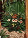 A natural flower arrangement featuring gerberas, astroemeria, gypsophila and green leaves