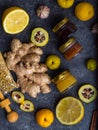 Natural flu and cold remedy ingredients, chamomile flowers, cinnamon sticks, ginger, lemon, honey, cydonia, propolis, garlic Flat Royalty Free Stock Photo