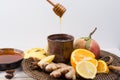Natural flu and cold remedy - orange and lemon fruit, fresh ginger, honey. Royalty Free Stock Photo