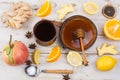 Natural flu and cold remedy - orange and lemon fruit, fresh ginger, honey. Royalty Free Stock Photo