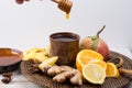 Natural flu and cold remedy - orange and lemon fruit, fresh ginger, honey. Royalty Free Stock Photo