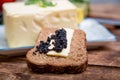 Natural food and ingredients, breakfast with butter, bread and black caviar
