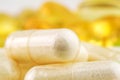 Natural food supplement pills, glucosamine and omega 3 capsules, macro image. Royalty Free Stock Photo