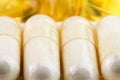 Natural food supplement pills, glucosamine and omega 3 capsules, macro image. Royalty Free Stock Photo