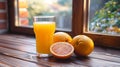 Natural foods A glass of orange juice with oranges on a wooden table Royalty Free Stock Photo