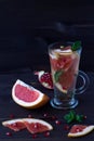 red cocktail from ripe fresh slices of grapefruit. detox water. diet healthy eating and weight loss concept, copy space for text Royalty Free Stock Photo