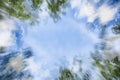 Natural frame, abstract background of blue sky with white clouds and green leaves, spring, summer, double composition Royalty Free Stock Photo