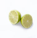 Natural fresh lime with slice of green lime citrus fruit stand isolated on white background. Royalty Free Stock Photo