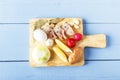 Natural fresh products for healthy dish on wooden cutting board. Top view on wooden table Royalty Free Stock Photo