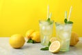 Natural freshly made lemonade on grey marble table. Summer refreshing drink