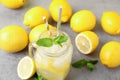 Natural freshly made lemonade and mint on grey table, closeup. Summer refreshing drink