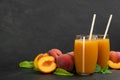 Natural freshly made peach juice on grey table. Space for text
