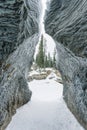 Natural frozen entrance of limestone mountain cave in winter Royalty Free Stock Photo