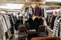 Natural fur coats hang on hangers in a store. Sale of winter warm clothes. Turkish shop Royalty Free Stock Photo